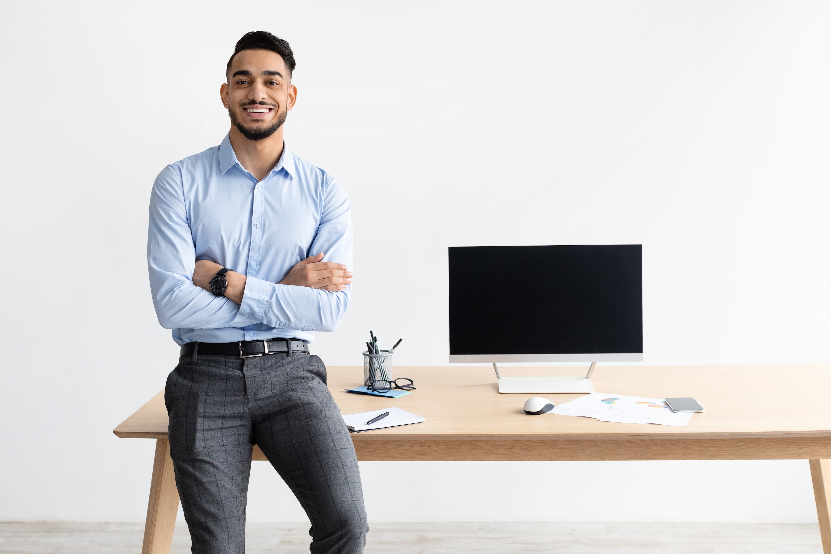 man standing in front of desk